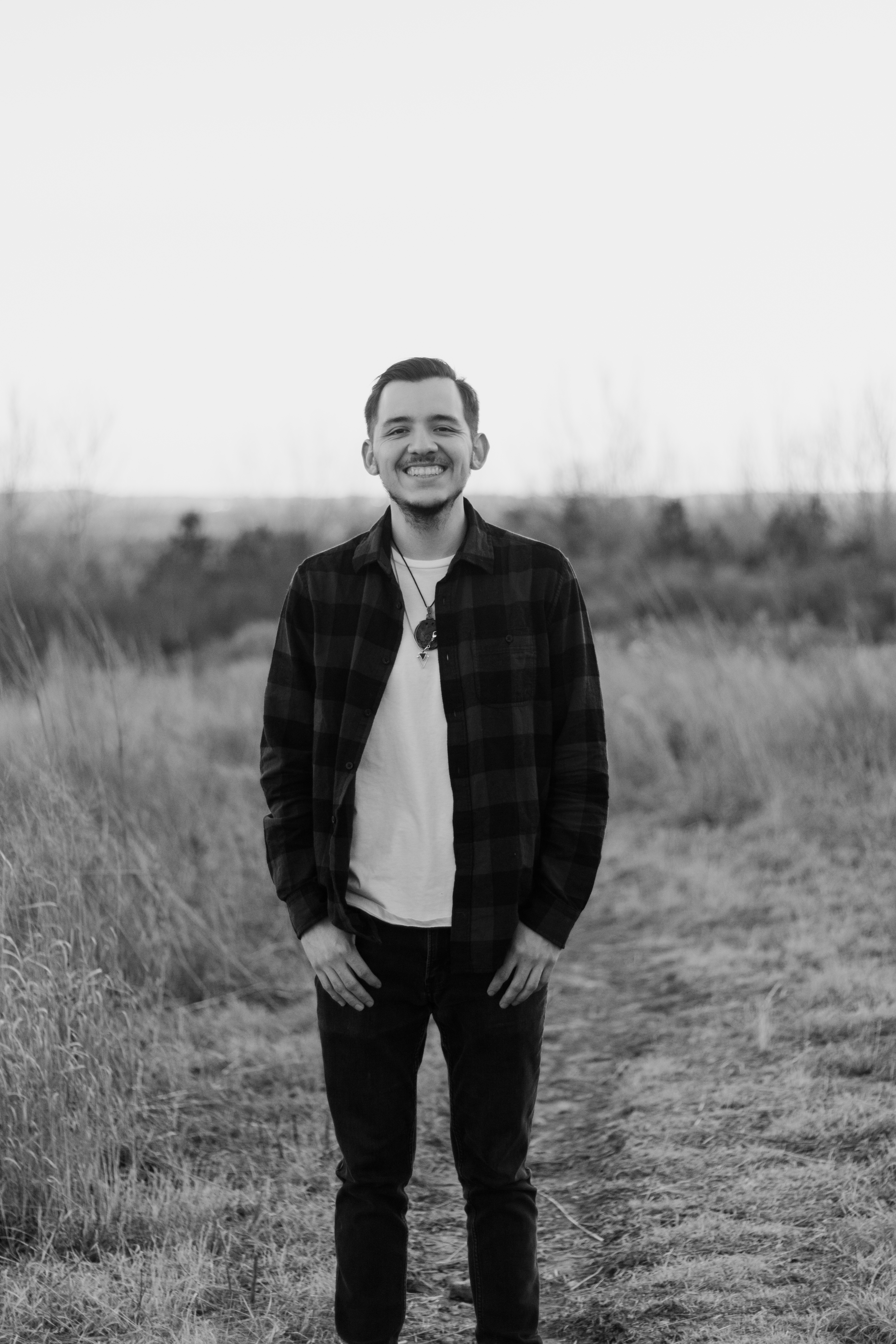 Fabian Uribe standing in a field smiling